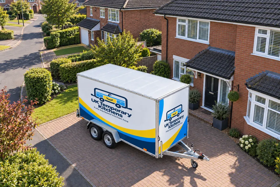 Aerial view of the branded kitchen trailer parked on the driveway of a brick semi